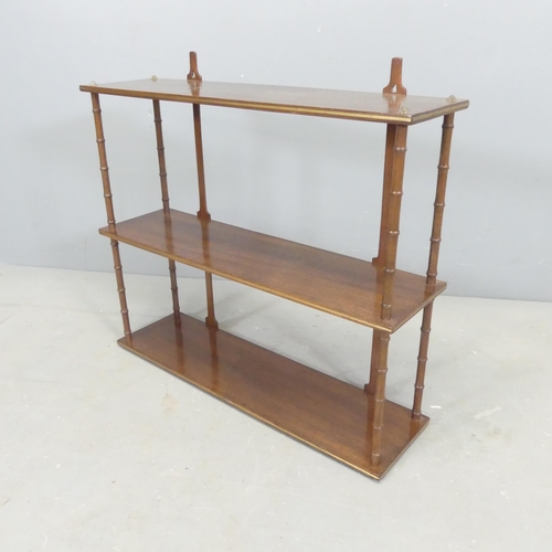 2680 - A 19th century mahogany and brass-inlaid three tier hanging shelf. 61x53x16cm.