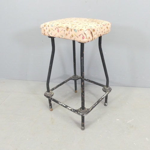 2681 - A vintage industrial stool, with tubular metal frame. Height 64cm.