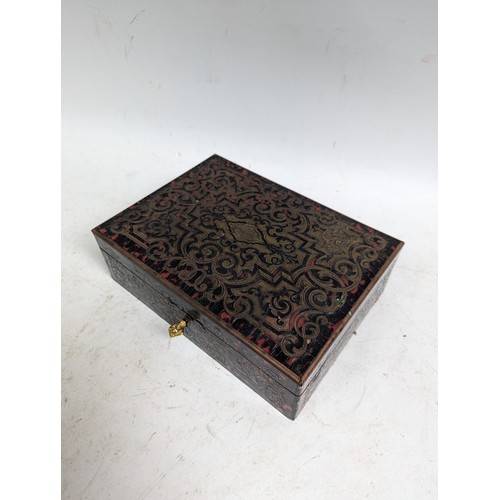 57 - A 19th century boulle-work lady's sewing box, having a blue silk fitted interior with lift-out tray,... 