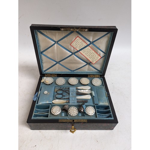 57 - A 19th century boulle-work lady's sewing box, having a blue silk fitted interior with lift-out tray,... 