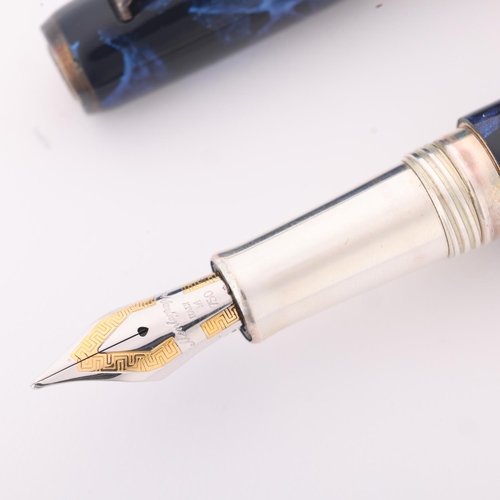 502 - A Montegrappa fountain pen, model Z300/XMB-FP B, marble blue resin body with 18ct gold M nib and sil... 