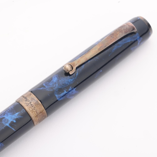 502 - A Montegrappa fountain pen, model Z300/XMB-FP B, marble blue resin body with 18ct gold M nib and sil... 