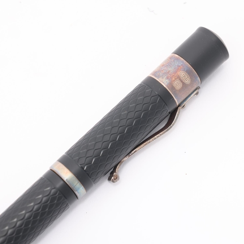 504 - A Yard-O-Led fountain pen, with black engine turned resin body, 18ct M Nib, and 2003 Birmingham hall... 