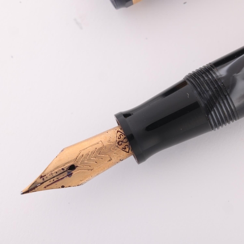 505 - An Omas Dama fountain pen, with 14ct nib and black marbled resin, marked 