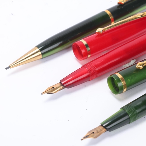 515 - A vintage Conway Stewart Dinkie 570 fountain pen and 54 pencil set, with Lumina Green body and 14ct ... 