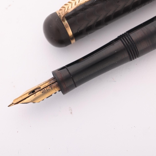 521 - A Mabie, Todd & Co, a Swan 2C Eye-dropper pen with 