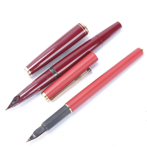 548 - A 1970s' Montblanc 221 piston fill fountain pen, with burgundy resin body and gilt metal trim, 14ct ... 