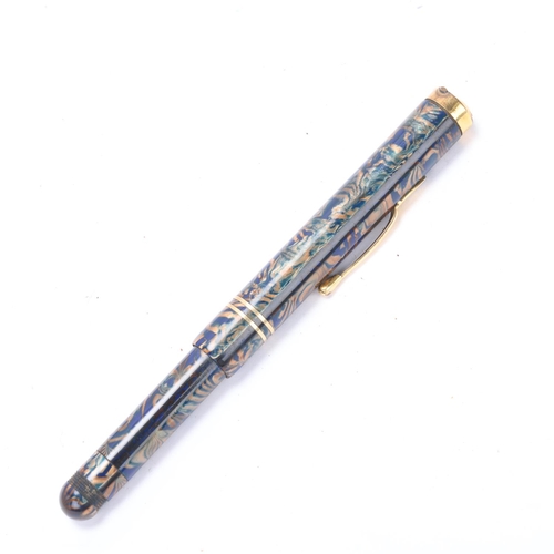 561 - A Pullman blue and gilt marbled fountain pen with 14k nib and gilt mounts, with push action pop up n... 