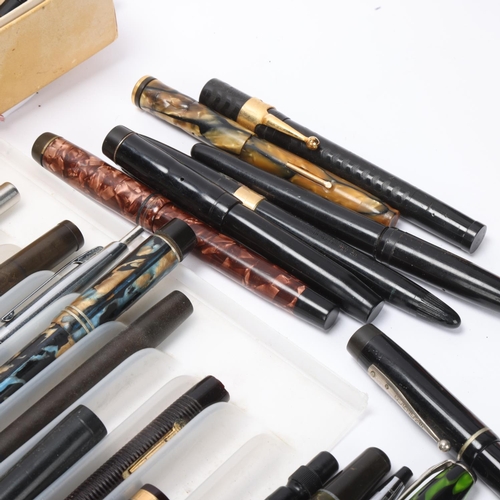 580 - A large quantity of fountain pens, spare pen parts, many gold nibs, all for spares and repairs most ... 