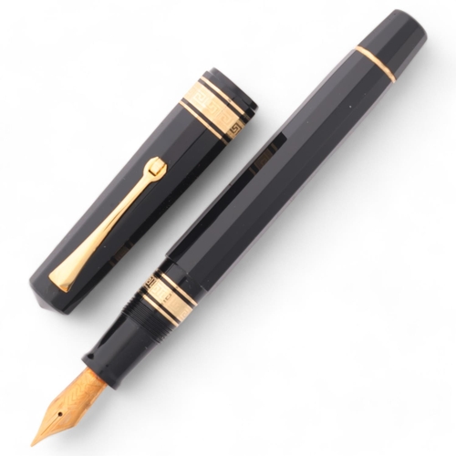 584 - An Omas Dama fountain pen, with 14ct EF nib and black resin piston fill body, boxed with papers