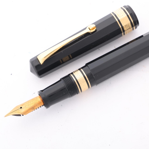 584 - An Omas Dama fountain pen, with 14ct EF nib and black resin piston fill body, boxed with papers