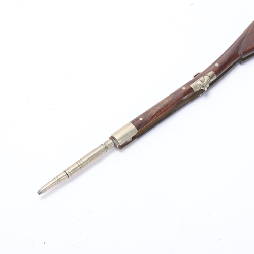 590 - An antique pencil and penknife in the form of a percussion rifle, rosewood and steel body, closed le... 