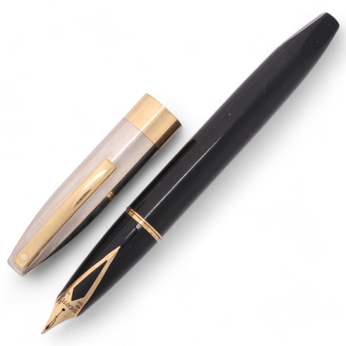 593 - A Sheaffer Legacy Heritage fountain pen, with black body and palladium cap and 18ct gold nib