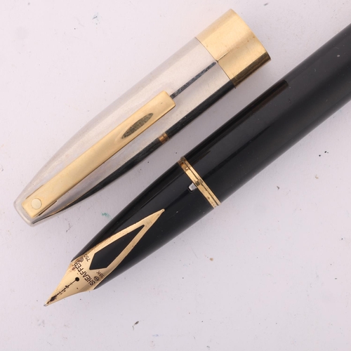 593 - A Sheaffer Legacy Heritage fountain pen, with black body and palladium cap and 18ct gold nib