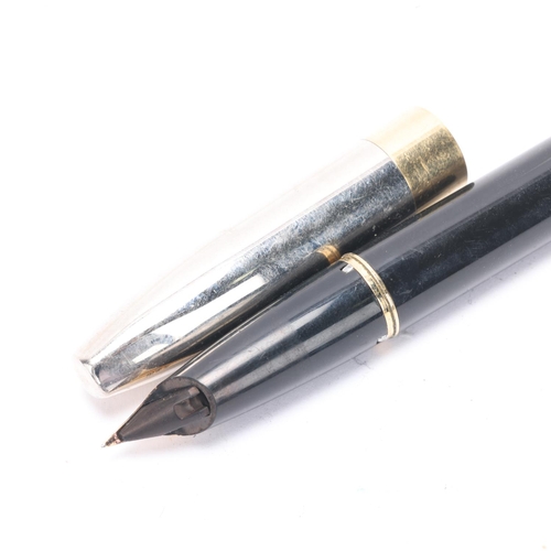 593 - A Sheaffer Legacy Heritage fountain pen, with black body and palladium cap and 18ct gold nib