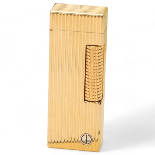 600 - A Dunhill gold plated lighter, serial number 97966, in original box