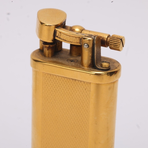 601 - A vintage Dunhill gold plated table lighter,  makers marks to base, No 18763, height 10cm