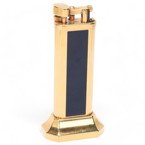 602 - A vintage Dunhill gold plated table lighter, with black lacquer panels, makers marks to base, No 239... 