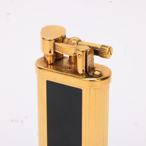 602 - A vintage Dunhill gold plated table lighter, with black lacquer panels, makers marks to base, No 239... 