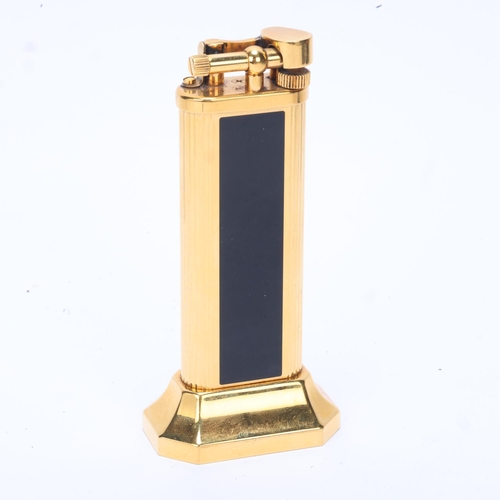 602 - A vintage Dunhill gold plated table lighter, with black lacquer panels, makers marks to base, No 239... 