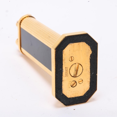 602 - A vintage Dunhill gold plated table lighter, with black lacquer panels, makers marks to base, No 239... 