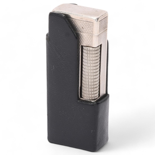 603 - A vintage silver Dunhill Rollagas lighter, marked 925 to base with makers mark AD, engine turned bod... 