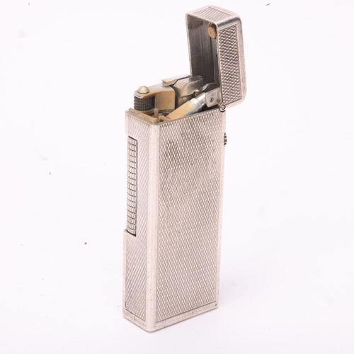 603 - A vintage silver Dunhill Rollagas lighter, marked 925 to base with makers mark AD, engine turned bod... 