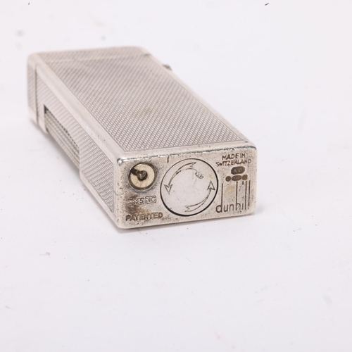 603 - A vintage silver Dunhill Rollagas lighter, marked 925 to base with makers mark AD, engine turned bod... 