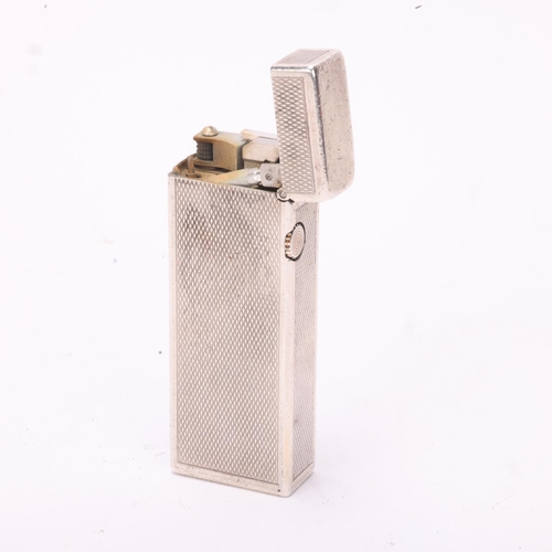 603 - A vintage silver Dunhill Rollagas lighter, marked 925 to base with makers mark AD, engine turned bod... 