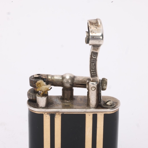 607 - A 1929 hallmarked silver Dunhill lighter, with gilt and black lacquer body, gilt metal crown detail,... 