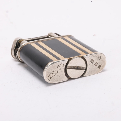 607 - A 1929 hallmarked silver Dunhill lighter, with gilt and black lacquer body, gilt metal crown detail,... 