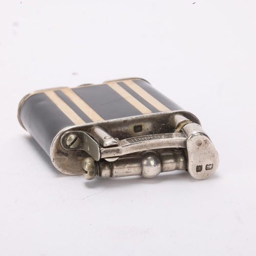 607 - A 1929 hallmarked silver Dunhill lighter, with gilt and black lacquer body, gilt metal crown detail,... 