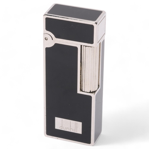 608 - **WITHDRAWN**A vintage Dunhill silver plated Rollagas lighter, with black lacquer detail and paste g... 