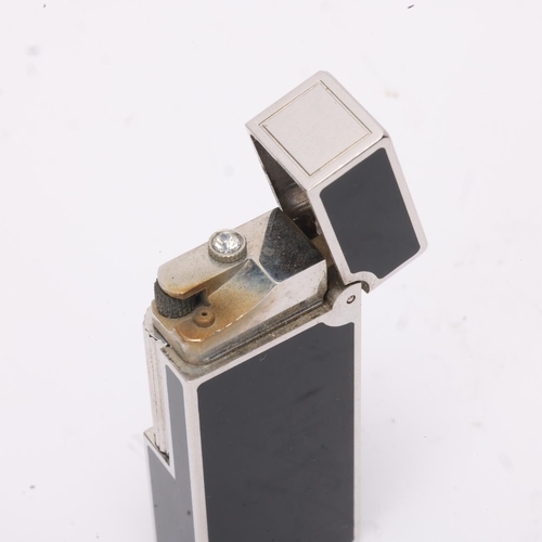 608 - **WITHDRAWN**A vintage Dunhill silver plated Rollagas lighter, with black lacquer detail and paste g... 