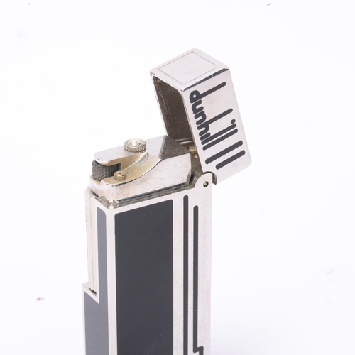 609 - **WITHDRAWN**A vintage Dunhill silver plated Rollagas lighter, with black lacquer detail and paste g... 