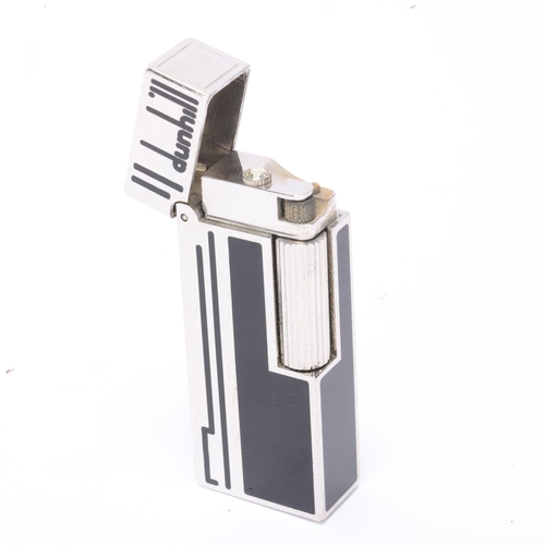 609 - **WITHDRAWN**A vintage Dunhill silver plated Rollagas lighter, with black lacquer detail and paste g... 