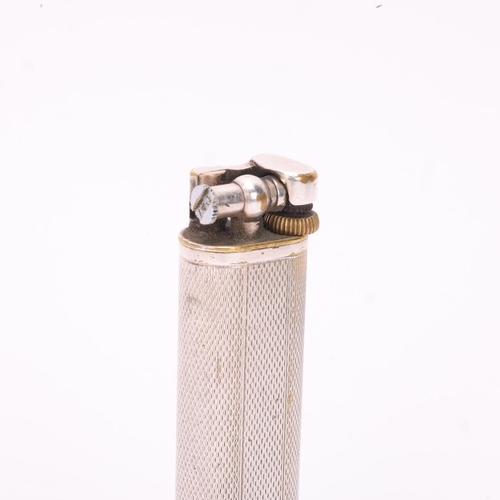 614 - A vintage Dunhill silver plated lighter, slimline model with hammer arm, makers marks to base, heigh... 