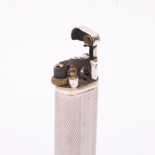 614 - A vintage Dunhill silver plated lighter, slimline model with hammer arm, makers marks to base, heigh... 