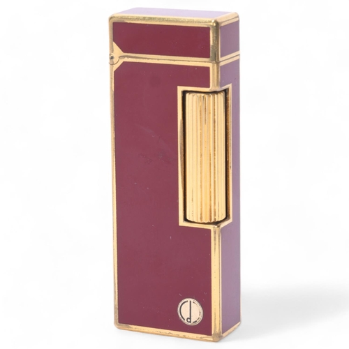 616 - A vintage Dunhill Rollagas lighter, with gold plated and red lacquer body, makers marks to base, len... 