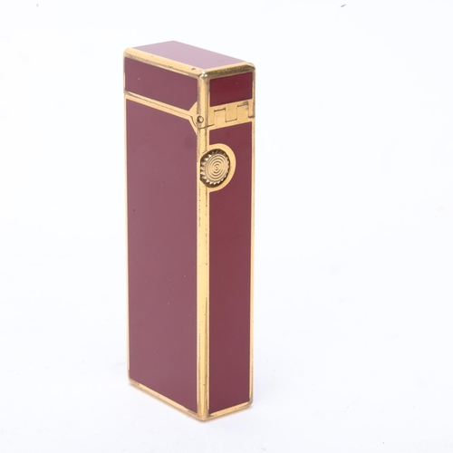 616 - A vintage Dunhill Rollagas lighter, with gold plated and red lacquer body, makers marks to base, len... 