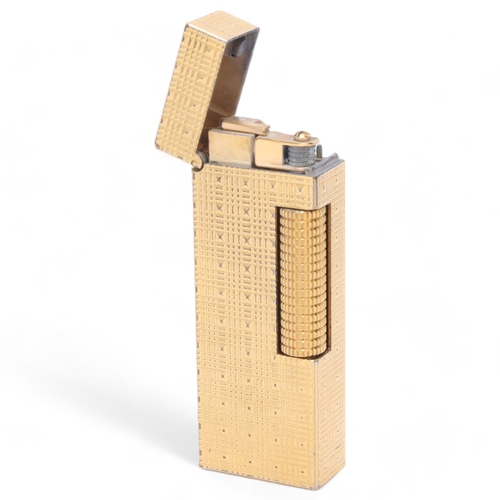 618 - A vintage Dunhill Rollagas gold plated lighter, textured body, makers marks to base, length 6.3cm