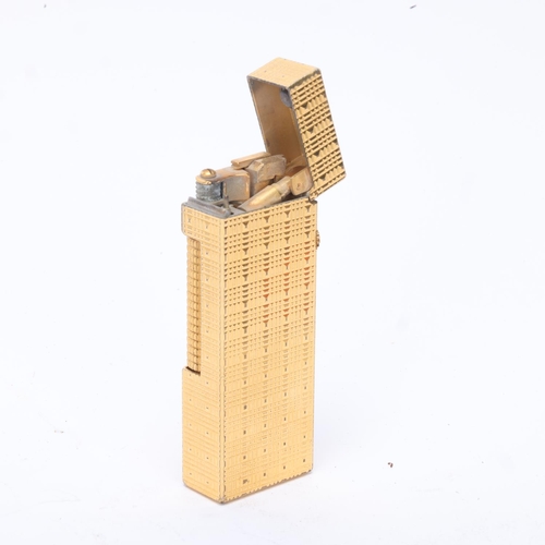 618 - A vintage Dunhill Rollagas gold plated lighter, textured body, makers marks to base, length 6.3cm