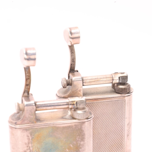 629 - 2 vintage Dunhill silver plated table lighters, makers marks to hammer arm, height 10.5cm