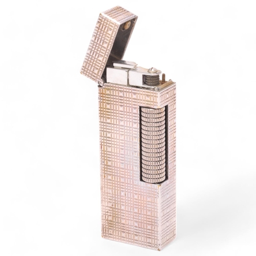 631 - A vintage Dunhill Rollagas lighter, with silver plated textured body, makers marks to base, length 6... 