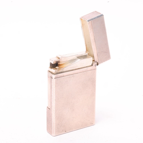 633 - A vintage SJ Dupont, Paris silver plated lighter, numbered 1J8CD05, height 6.2cm,