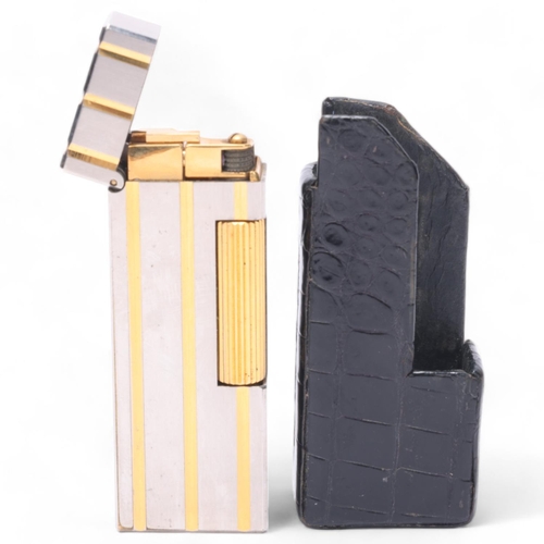 639 - A vintage Dunhill Rollagas silver and gold plated lighter, in Dunhill leather slip-case, makers mark... 