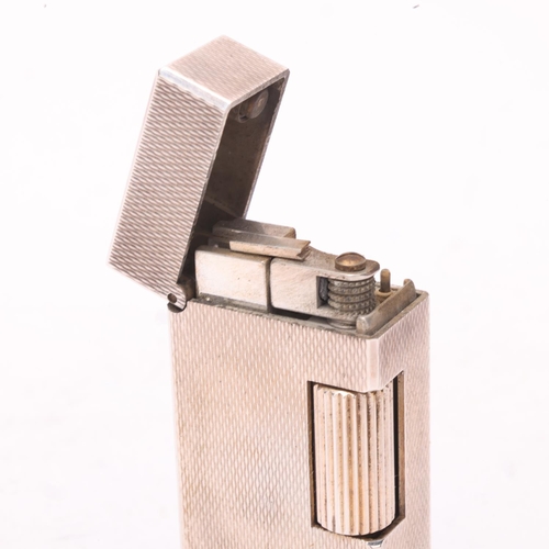 641 - A vintage Dunhill silver plated Rollagas lighter, engine tuned body, makers marks to base No 50230, ... 