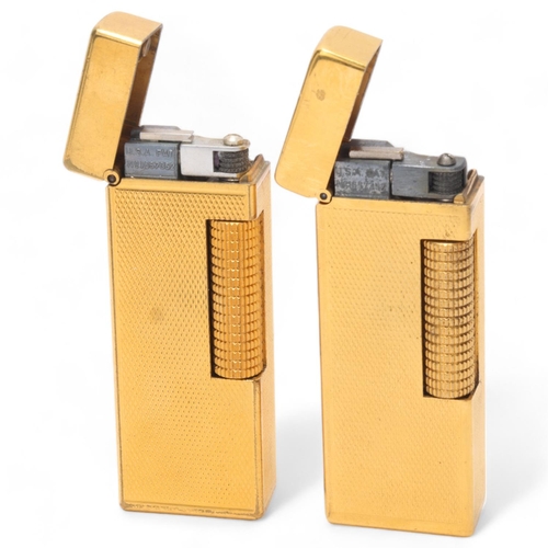 643 - 2 vintage Dunhill gold plated Rollagas lighters, with engine turned bodies, mechanism USA Pat No 165... 