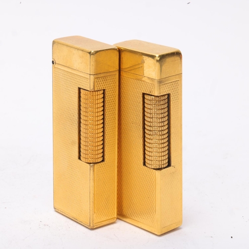 643 - 2 vintage Dunhill gold plated Rollagas lighters, with engine turned bodies, mechanism USA Pat No 165... 