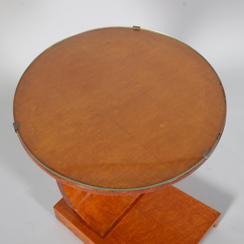 100 - Art Deco maple circular occasional table, with glass top and platform base, top diameter 46cm, heigh... 